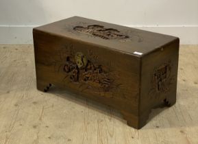 A Chinese style carved camphor wood blanket box H37cm, W70cm, D35cm.