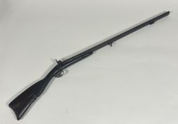 A mid 19thc double barrelled muzzle loading shotgun, twin hammers side by side barrels (87cm), on