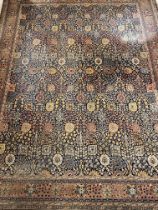 A large early  20th century machine woven Persian style area carpet, probably Wilton, the dark