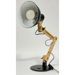 A modern Tomons angle-poise lamp (wood swing arm desk lamp)
