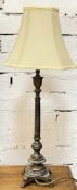 A substantial cast metal lamp with classical style base and plain shade (h- 77cm)