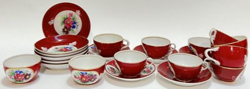 A Russian Gardner porcelain part tea and coffee set with rouge ground and hand painted rose and leaf
