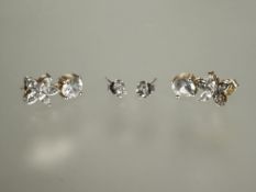 A pair of 9ct white gold set diamond stud earrings in claw setting approximately 0.05ct and a pair