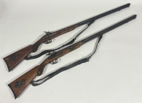 A pair of reproduction 19thc single barrelled muzzled loading rifles with percussion lock, steel
