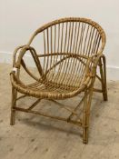 A 1970's boho style bamboo armchair. H68cm, W64cm.