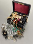 A vintage jewellery box containing a collection of jewellery to include a cultured pearl bead