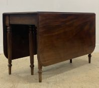 A Regency mahogany drop leaf dining table, the rectangular top with moulded edge raised on turned,