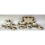 A Royal Albert country rose pattern tea service comprising, a teapot (h-20cm), six tea cups, six