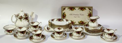 A Royal Albert country rose pattern tea service comprising, a teapot (h-20cm), six tea cups, six