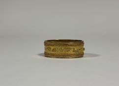A Victorian yellow metal hinged bangle (unmarked and untested), engraved to one half with ferns