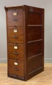 A mahogany four drawer hanging cabinet by 'Shannon' circa 1910-20, the fluted frame flanked by