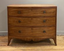 A Regency mahogany bowfront chest, fitted with three long graduated and cock beaded drawers, above a