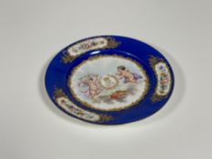 A Sevres porcelain dinner plate from a Louis-Philippe service, painted to the well with a crowned