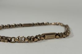 A late 19th century yellow metal chainlink necklace, one lobster clasp stamped "Solid Gold", of