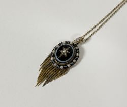 A 19th century yellow metal, banded agate and seed pearl locket pendant, the central cabochon banded