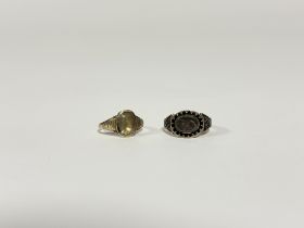 A 19th century 10ct gold mourning ring, the oval glazed compartment enclosing plaited hair, within a