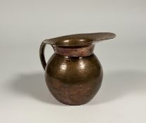 An Aesthetic movement copper ewer, third quarter 19th century, in the manner of Christopher Dresser,