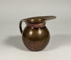 An Aesthetic movement copper ewer, third quarter 19th century, in the manner of Christopher Dresser,