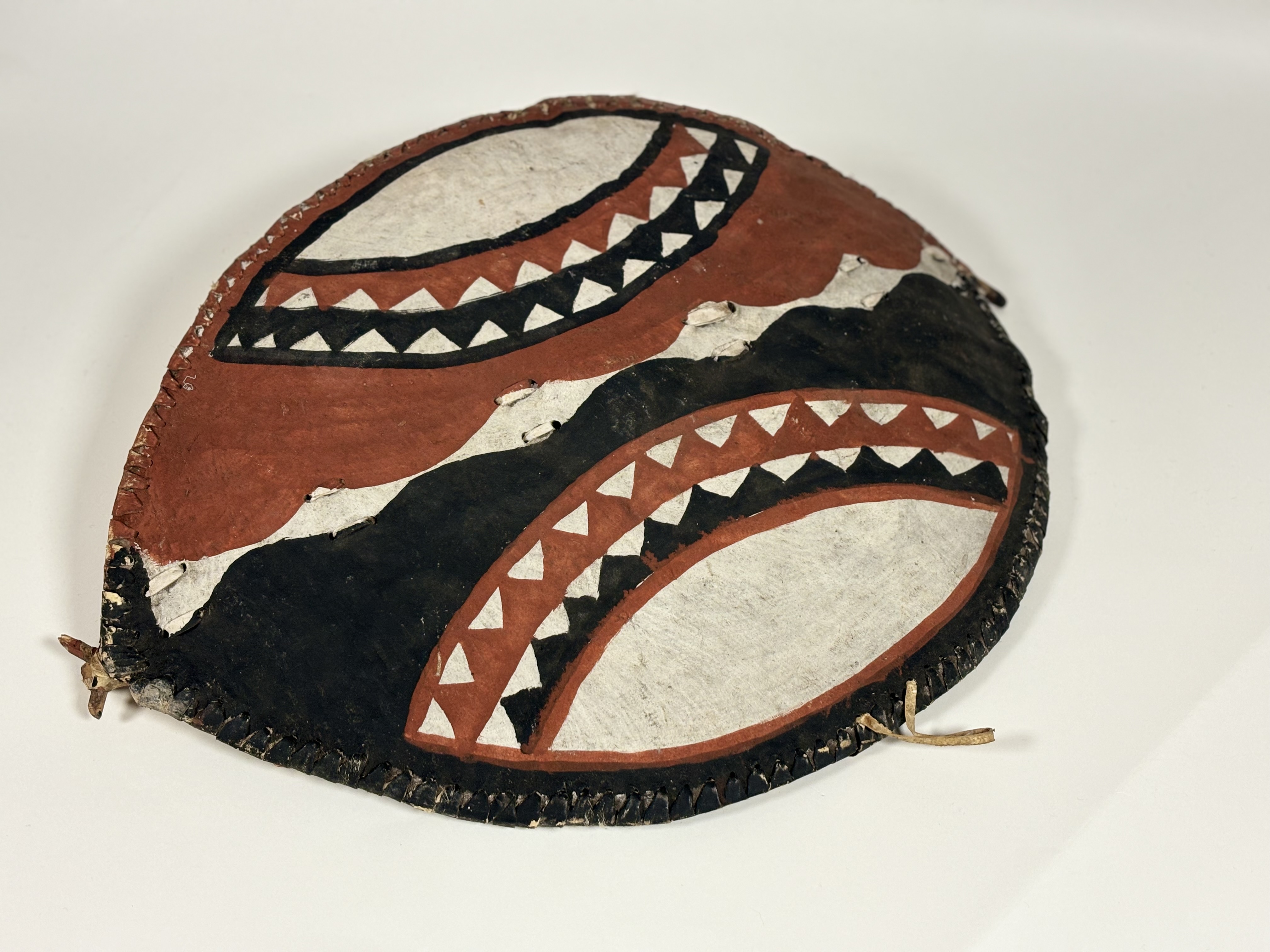 A Maasai hide hunting shield and spear, third quarter 20th century, presented by President Jomo