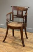 An Anglo-Indian mahogany chair, first half of the 19th century, the curved and scrolled crest rail
