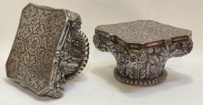 A large pair of Indian white metal capitols of Corinthian type, each gadroon and floral-moulded
