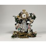 A gilt-bronze, tole peinte and porcelain mantel clock in the Louis XV taste, late 19th century,