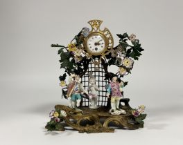 A gilt-bronze, tole peinte and porcelain mantel clock in the Louis XV taste, late 19th century,