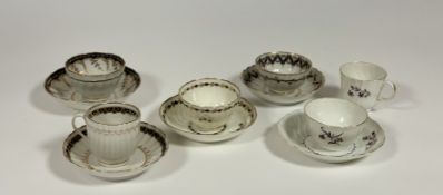 A group of late 18th century Worcester porcelain tea bowls and saucers including: a trio of bowl,