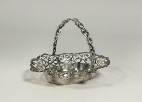 An Edwardian silver swing-handled cake basket, C.M. & Co., Birmingham 1909, of oval form, with