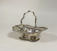 A George V silver footed swing-handled cake basket, Atkin Brothers, Sheffield 1912, of shaped