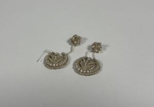 A pair of Regency seed pearl drop earrings, each drop of crescent form centred by a foliate spray