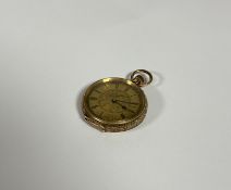 A Swiss 14ct gold lady's fob watch, early 20th century, the gilt dial and chapter ring with Roman