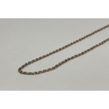 A yellow metal belcher link guard chain, unmarked, the lobster clasp indistinctly stamped. Length