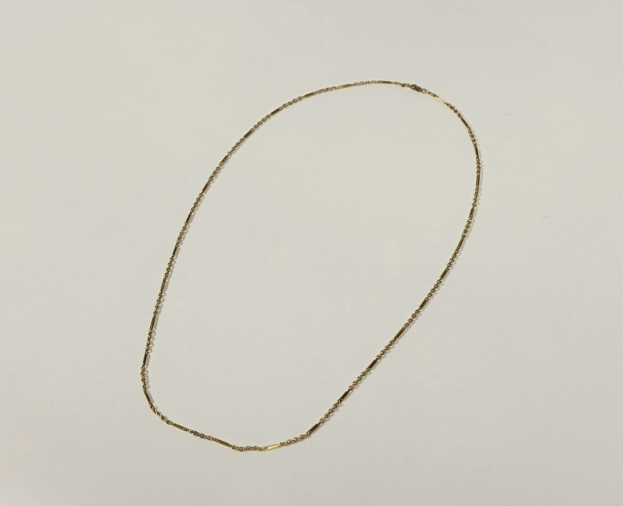 An 18ct gold chainlink necklace, of twin rectangular bars spaced by leaf-cast fancy links, - Image 2 of 2