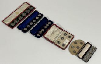A collection of early 20th century cased silver and white metal buttons comprising: a set of six