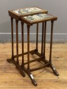 A mahogany nest of two tables, late 19th century, the top of each table inset with hand-painted