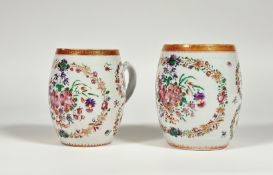 A graduated pair of Chinese Export famille rose porcelain mugs, c. 1800, of barrel form, decorated