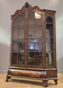 A Dutch walnut and marquetry bombe vitrine cabinet, 19th century, the arched and undulating top