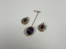 A pair of late Victorian yellow metal, seed pearl and cabochon drop earrings, each centred by a pink