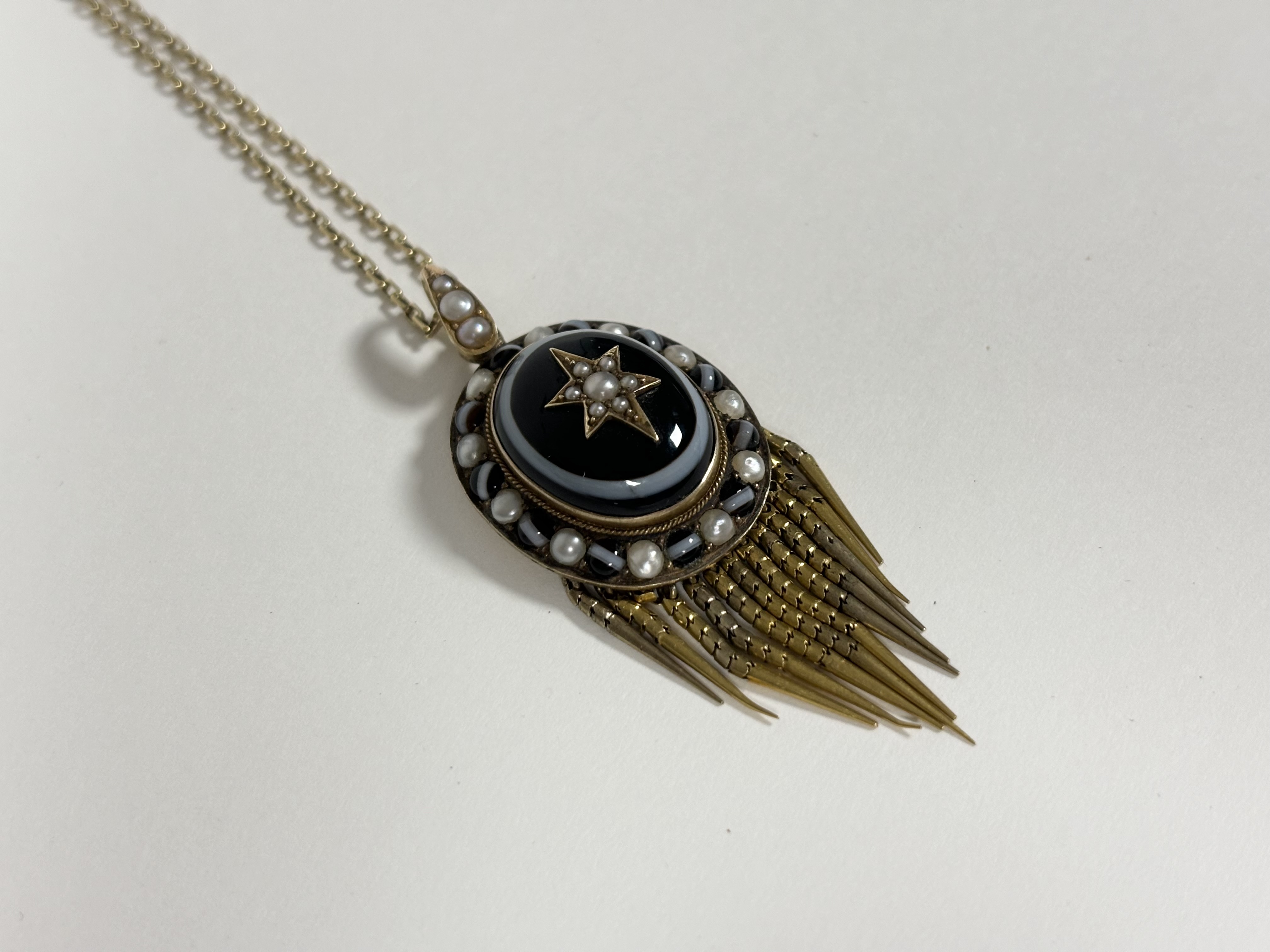 A 19th century yellow metal, banded agate and seed pearl locket pendant, the central cabochon banded - Image 3 of 4