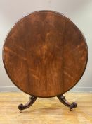 A mid Victorian rosewood centre table, the circular tilt-top with moulded edge above a faceted