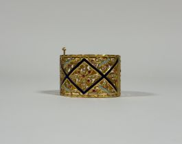A striking hinged yellow metal bangle (possibly high carat gold, unmarked and untested), trellis-