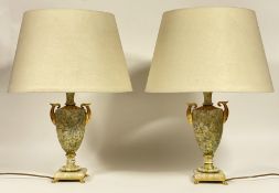 A pair of serpentine marble table lamps of urn form in the Neoclassical style, with scrolled gilt