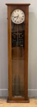 A synchronome electric clock, the walnut case with full length glazed door enclosing a silvered dial