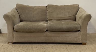 A contemporary fawn plush two seat sofa, with squab cushions and raised on block supports. H80cm,