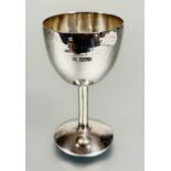 A modern Britannia standard silver goblet with planished finish or turned column and domed