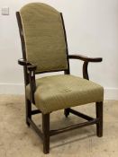 A George III oak open armchair with upholstered back and seat, with out-swept arms and raised on