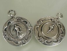A pair of Birmingham silver foot ball medals, one for V Watson Pickett cup winner 1948-49 D x 3cm