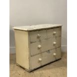 A small Victorian white painted pine chest fitted with two short and three long drawers on stile