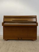 A mid century teak cased bungalow piano by Zender, iron framed and overstrung. H100cm, W133cm D50cm.